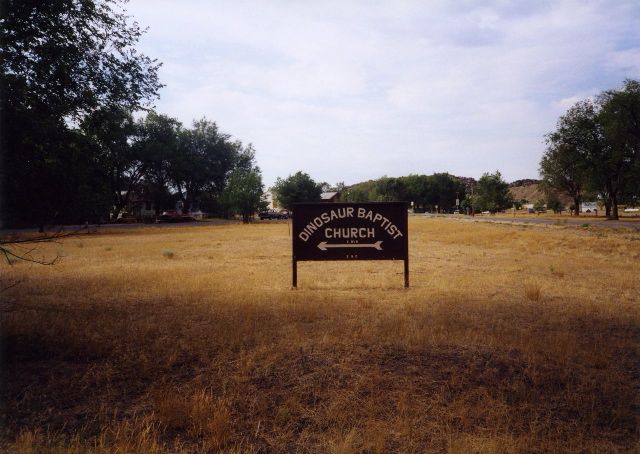 Another shot of the directional sign for Dinosaur Baptist Church, from earlier in 2011, I think.  From Text of the Day.